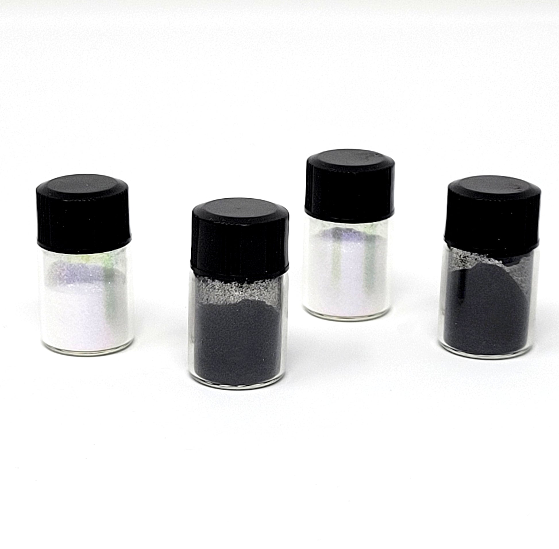 Temporary Tattooth Colorants.  This shows Black Shimmer and Blue Galaxy Iridescent Colorant.  Used together they create a stunning tooth tattoo colorant.