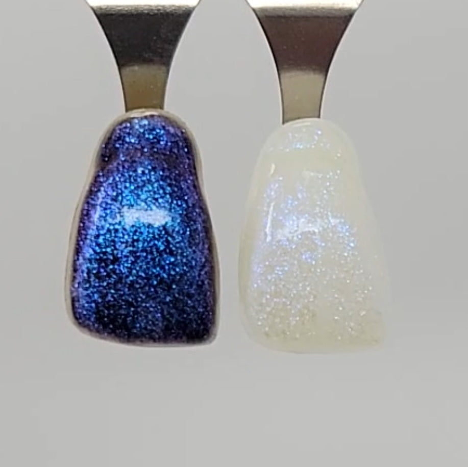 Blue Galaxy Temporary Tattooth Colorant on a demo tooth.  These colorants can be applied to teeth to temporarily alter their color or iridescence.