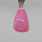 Bubble Gum Pink Temporary Tattooth Colorant on a demo tooth.  These colorants can be applied to teeth to temporarily alter their color or iridescence.