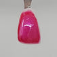 Dark Pink Temporary Tattooth Colorant on a demo tooth.  These colorants can be applied to teeth to temporarily alter their color or iridescence.