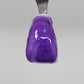 Deep Purple Temporary Tattooth Colorant on a demo tooth.  These colorants can be applied to teeth to temporarily alter their color or iridescence.