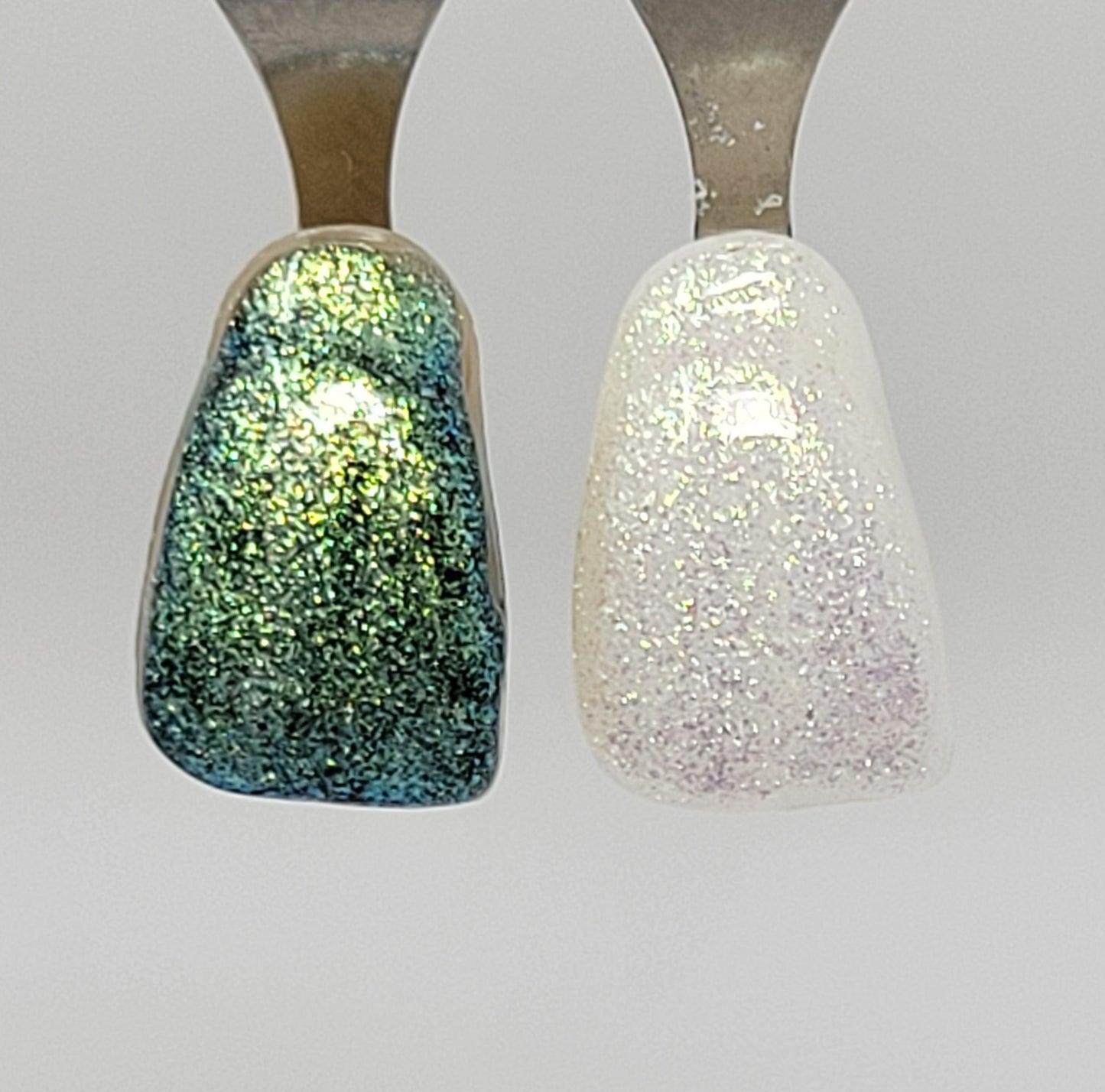 Green Galaxy Temporary Tattooth Colorant on a demo tooth.  These colorants can be applied to teeth to temporarily alter their color or iridescence.