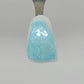 Sky Opal Temporary Tattooth Colorant on a demo tooth.  These colorants can be applied to teeth to temporarily alter their color or iridescence.