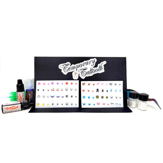 A photograph of the Temporary Tattooth Essentials Kit.  This kit allows you to apply temporary tattoos for teeth and temporary tooth colorants.  The photos shows a close up of the temporary tooth tattoos included in the kit.